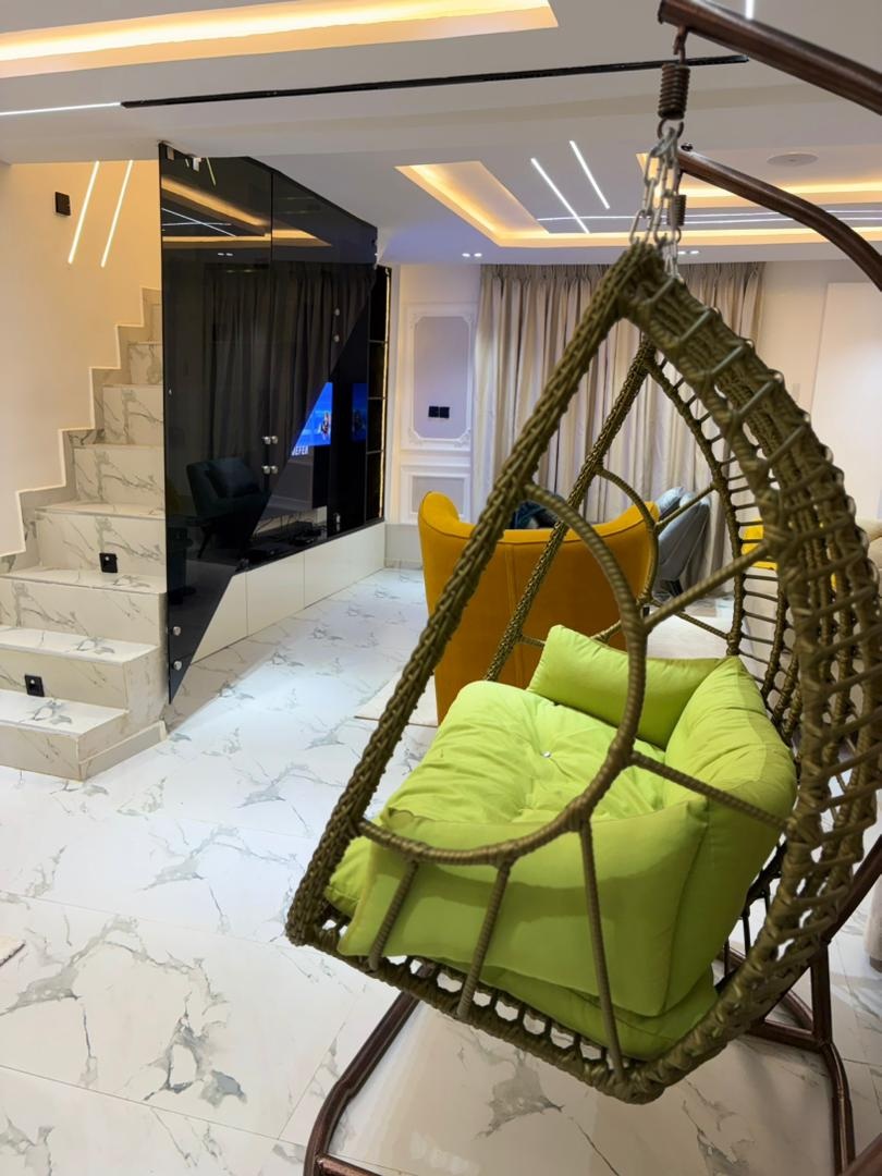 Hanging swing chair and marble staircase