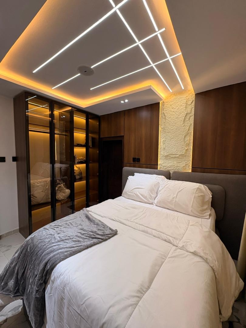 Bedroom with warm wood panelling